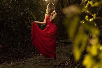 Photo of Woman Wearing Red Dress