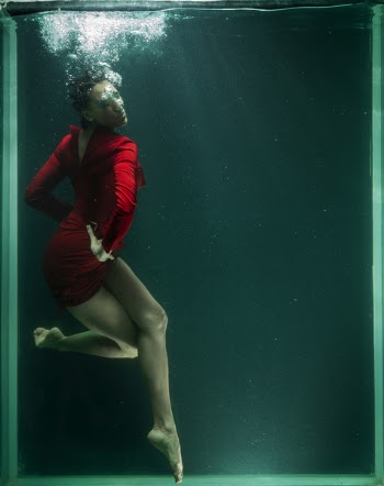 Photo of Woman Wearing Red Dress Underwater