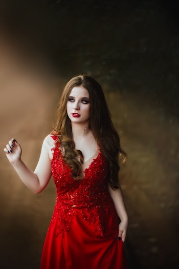 Photo of Woman Wearing Red Gown