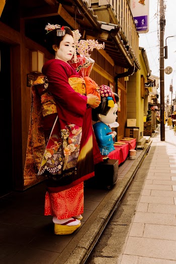 Photo Of Woman Wearing Red Kimono Standing On Street
