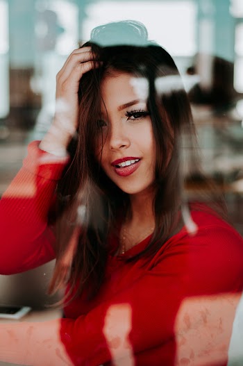 Photo of Woman Wearing Red Sweater