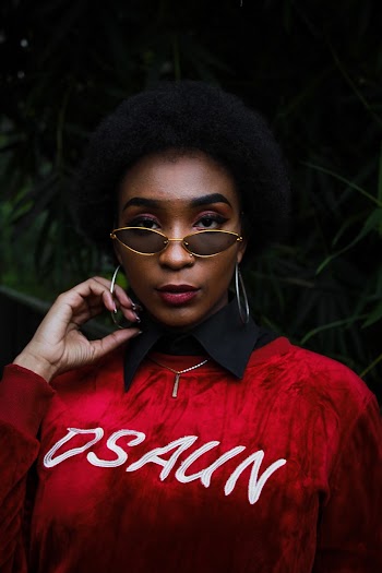 Photo of Woman Wearing Red Sweater and Sunglasses