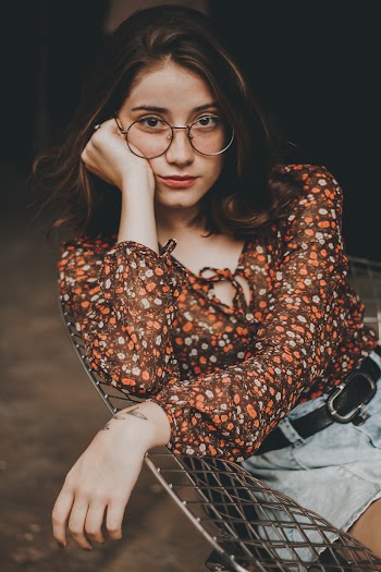Photo of Woman Wearing Round Eyeglasses