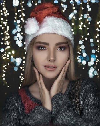 Photo of Woman Wearing Santa Hat