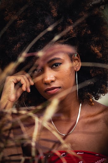 Photo of Woman Wearing Silver Necklace