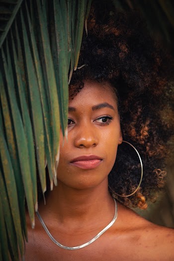Photo of Woman Wearing Silver Necklace