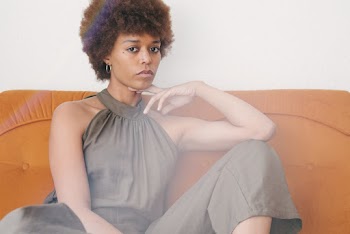 Photo of Woman Wearing Sleeveless Dress