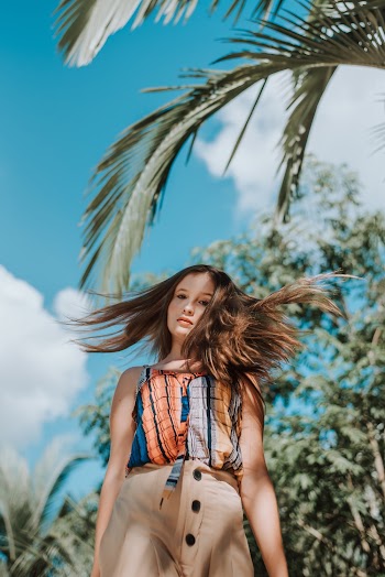 Photo of Woman Wearing Sleeveless Shirt