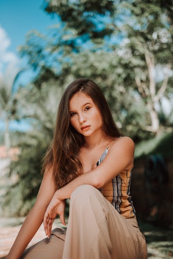 Photo of Woman Wearing Sleeveless Shirt
