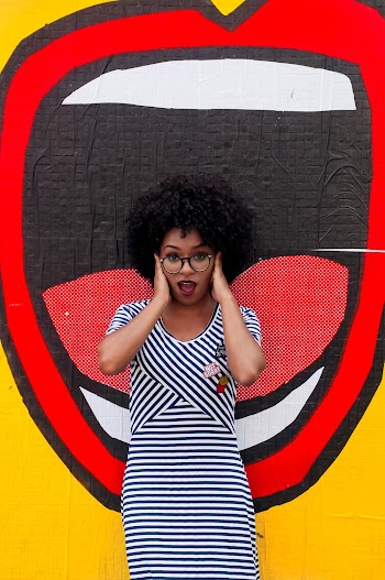 Photo of Woman Wearing Striped Dress