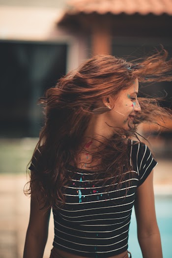 Photo of Woman Wearing Striped Shirt