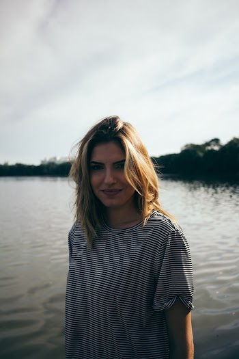 Photo Of Woman Wearing Striped Shirt