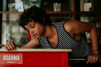 Photo Of Woman Wearing Striped Tank Top