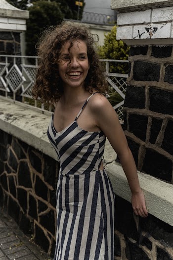 Photo Of Woman Wearing Stripped Dress