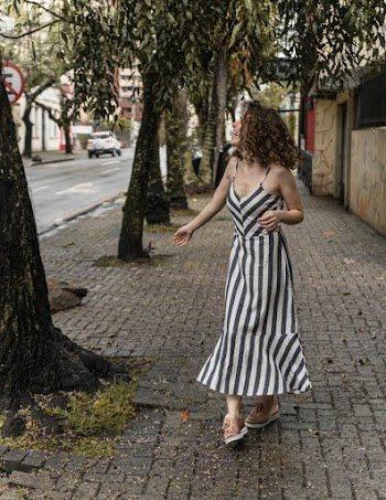 Photo Of Woman Wearing Stripped Dress