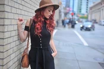 Photo of Woman Wearing Sun Hat While Looking Downward