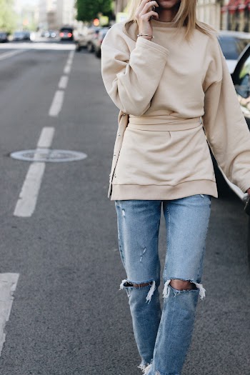 Photo Of Woman Wearing Tattered Denim Jeans