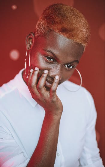 Photo of Woman Wearing White Collared Top