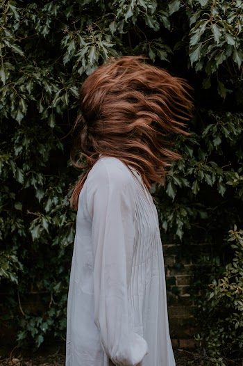Photo Of Woman Wearing White Dress