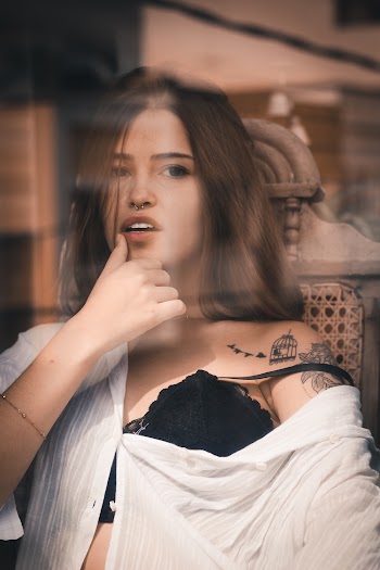 Photo of Woman Wearing White Dress Shirt