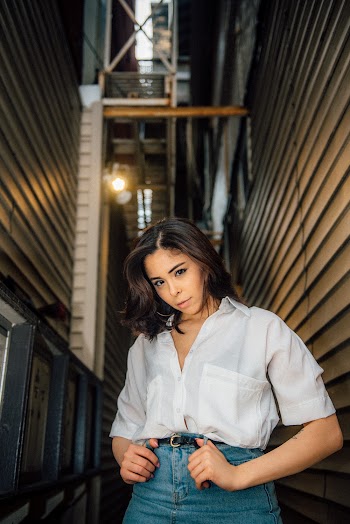 Photo of Woman Wearing White Dress Shirt
