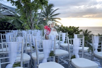 Photo of Woman Wearing White Dress Sitting on Chair