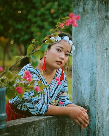 Photo Of Woman Wearing White Floral Headdress