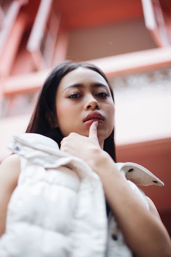 photo of woman wearing white jacket