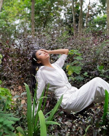 Photo of Woman Wearing White Jumpsuit