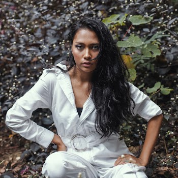 Photo of Woman Wearing White Jumpsuit