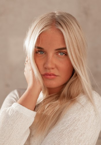 Photo of Woman Wearing White Long-sleeved Top