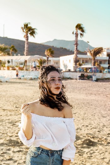Photo of Woman Wearing White Off-shoulder Blouse