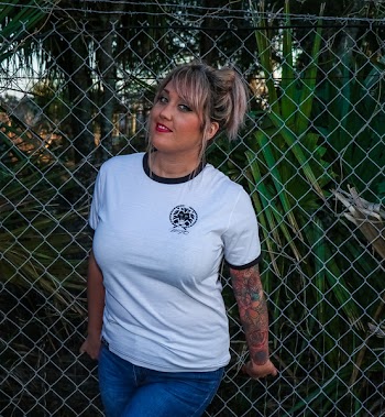 Photo of Woman Wearing White Ringer Tee and Blue Jeans