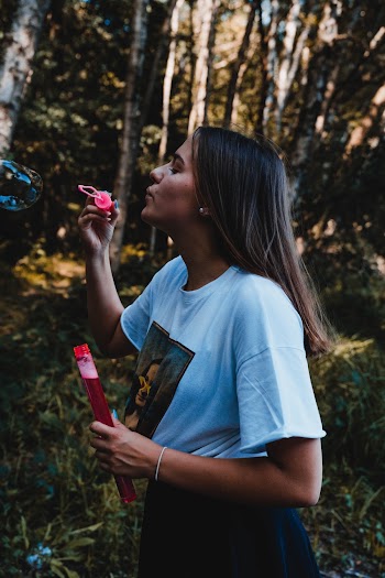 Photo Of Woman Wearing White Shirt