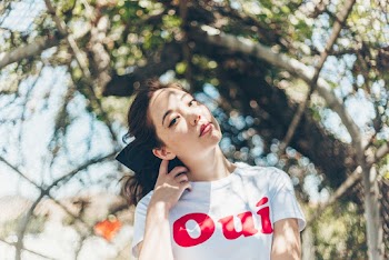 Photo Of Woman Wearing White Shirt