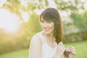Photo of Woman Wearing White Sleeveless Top