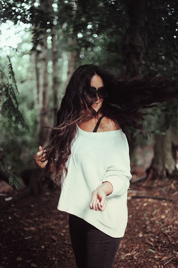 Photo Of Woman Wearing White Sweater