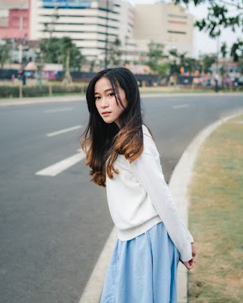 Photo Of Woman Wearing White Sweater