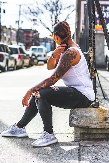 Photo of Woman Wearing White Tank Top