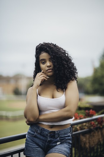 Photo of Woman Wearing White Tank Top