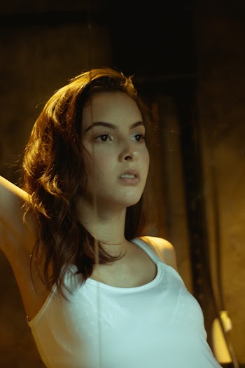Photo of Woman Wearing White Tank top