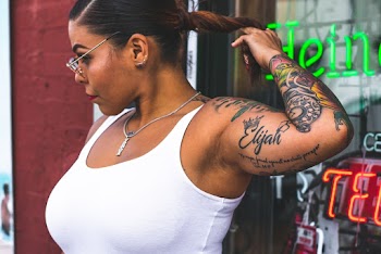 Photo of Woman Wearing White Tank Top
