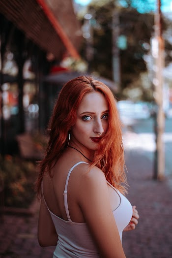 Photo of Woman Wearing White Tank Top