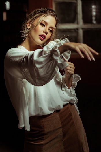 Photo Of Woman Wearing White Top
