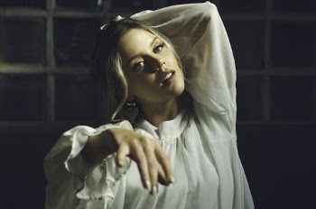 Photo Of Woman Wearing White Top