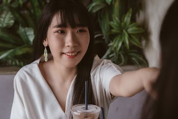Photo Of Woman Wearing White Top