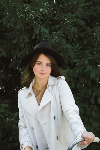 Photo of Woman Wearing White Trench Coat