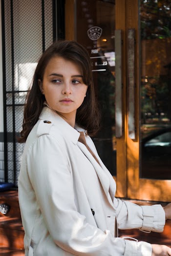 Photo of Woman Wearing White Trench Coat