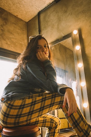 Photo Of Woman Wearing Yellow Checkered Pants