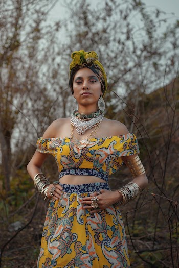 Photo of Woman Wearing Yellow Floral Off-Shoulder Crop Top and Skirts